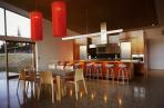 Artistic kitchen by Ingrid Geldof Design (IGD) includes LED lighting in this dramatic Lake Wanaka holiday home.  