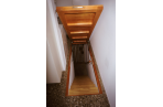 A trapdoor leads to a wine cellar.