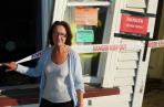 Liz Harris and warning signs saying do not enter.
