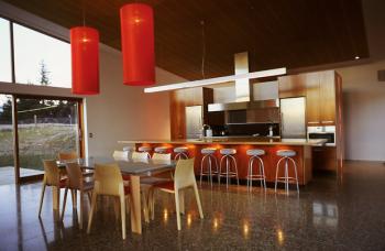 Artistic kitchen by Ingrid Geldof Design (IGD) includes LED lighting in this dramatic Lake Wanaka holiday home.  